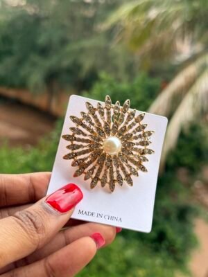 Broche soleil